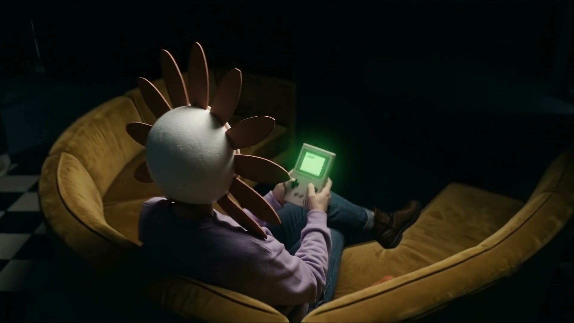 Frame at 0:01: The sofa and the handheld game